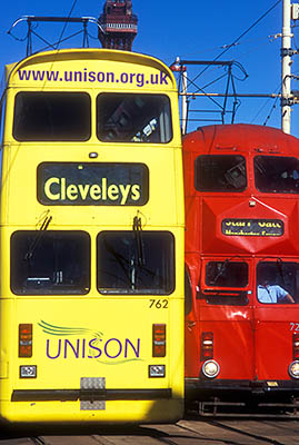 ENG: Manchester-Liverpool Urban Area, Blackpool Borough, The Golden Mile, Red and yellow double decker trams pass each other [Ask for #262.015.]