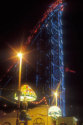 ENG: Manchester-Liverpool Urban Area, Blackpool Borough, Pleasure Beach, The Big One, one of the world's tallest roller coasters, looms above lighted street decorations during the Illuminations Festival, at night [Ask for #262.064.]