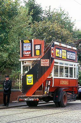 ENG: Northumbria Region, Durham, Beamish, The North of England Open Air Museum, Visitors Center Area, Bus driver (motion-blurred) stands beside early 20th century double decker motor bus, now in use [Ask for #262.297.]