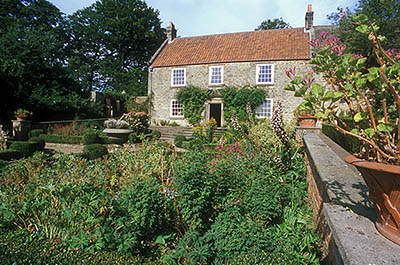 ENG: Northumbria Region, Durham, Beamish, The North of England Open Air Museum, Pockerley Manor, Garden, c 1825, in front of modest stone-built manor; fall blooms [Ask for #262.315.]