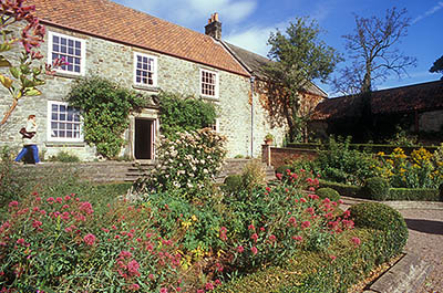 ENG: Northumbria Region, Durham, Beamish, The North of England Open Air Museum, Pockerley Manor, Garden, c 1825, in front of modest stone-built manor; fall blooms [Ask for #262.316.]