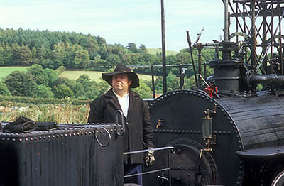 ENG: Northumbria Region, Durham, Beamish, The North of England Open Air Museum, Pockerley Waggonway, Stephenson's No. 2 engine, 1822, the predecessor of "The Rocket", newly built to the orig. design and in use. The engineer checks the boiler [Ask for #262.324.]