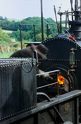 ENG: Northumbria Region, Durham, Beamish, The North of England Open Air Museum, Pockerley Waggonway, Stephenson's No. 2 engine, 1822, the predecessor of "The Rocket", newly built to the orig. design and in use. The engineer checks the boiler [Ask for #262.325.]