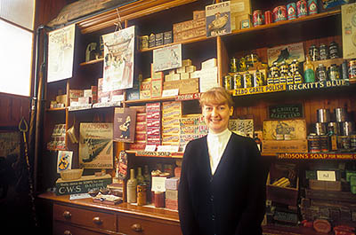 ENG: Northumbria Region, Durham, Beamish, The North of England Open Air Museum, The Town, Inside the Co-op Store; costumed interpreter as a store clerk [Ask for #262.345.]