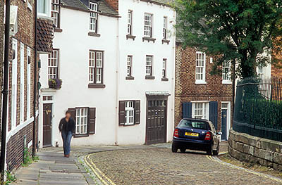 ENG: Northumbria Region, Durham, Durham Borough, Medieval Durham, The Upper Bailey. 17th c. and 18th c. townhouses line a cobblestoned lane. [Ask for #262.360.]