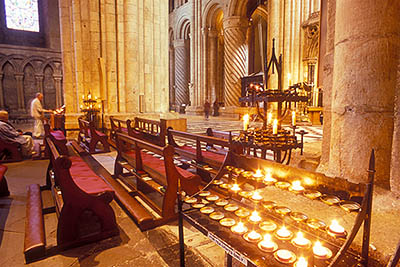 ENG: Northumbria Region, Durham, Durham Borough, Medieval Durham, Durham Cathedral. Interior; Prayer candles in the Nave, with view towards the North Transcept [Ask for #262.372.]