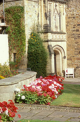 ENG: Northumbria Region, Durham, Durham Borough, Medieval Durham, Durham Cathedral. Garden flowers at the entrance to the former priory. [Ask for #262.385.]