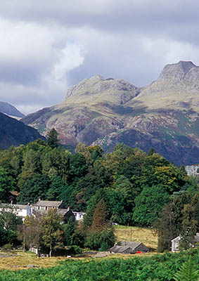 ENG: The Northwest Region, Cumbria, Lake District National Park, Central Lakes Area, Great Langdale, View over the village of Elterwater, with mountain peaks Lingmoor Fell (lt), Langdale Pikes (ctr), High Raise (rt) [Ask for #262.429.]