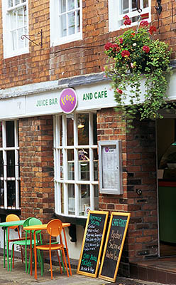 ENG: West Midlands Region, Shropshire, Shrewsbury and Atcham District, Shrewsbury, Froot, a juice bar and cafe, occupies a historic brick buildingon Butchers Row, a pedestrianized downtown street [Ask for #262.537.]