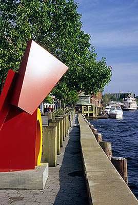 NC: New Hanover County, Cape Fear River Area, Wilmington, Riverfront, River Walk. Bright red abstract sculpture by river. [Ask for #263.057.]