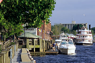 NC: New Hanover County, Cape Fear River Area, Wilmington, Riverfront, River Walk; view of yachts moors along river [Ask for #263.059.]