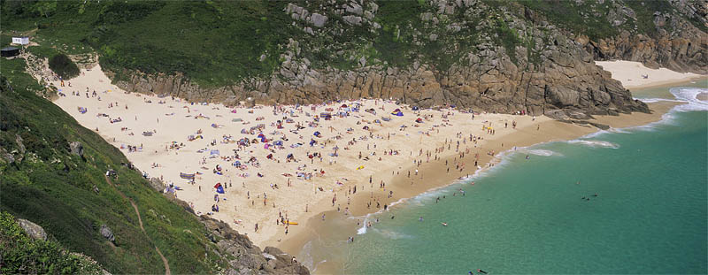 ENG: South West Region, Cornwall, Cornwall AONB, Penwith Peninsula, Porthcorno, Beach at Porth Corno, crowded with people, viewed from the cliffs above [multi-image panorama; digital only] [Ask for #268.18A.]