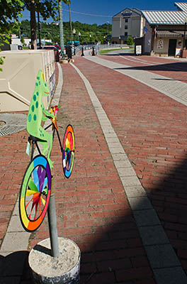 MD: Allegany County, Potomac River, Cumberland, Canal Park, Western terminus of the canal towpath; silk frog on bicycle sign advertises bike rentals [Ask for #269.098.]