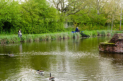 ENG: East Midlands Region, Leicestershire, Leicester Area, Leicester City, Kirby Muxloe Castle (EH), Fishermen enjoy the moat with ducks and geese [Ask for #270.029.]