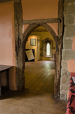 ENG: East Midlands Region, Leicestershire, Northwest Leicestershire, Coalville, Donnington le Heath Manor House, Furnished interior of 13th c. manor house; medieval arched wood doorway [Ask for #270.053.]