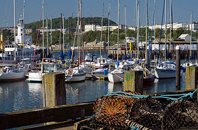 ENG: Yorkshire & Humberside Region, North Yorkshire, North Yorkshire Coast, Scarborough City, Old Harbour, View across harbor, with traps and lighthouse [Ask for #270.089.]