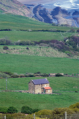 ENG: Yorkshire & Humberside Region, North Yorkshire, North Yorkshire Coast, Sea Cliffs, Ravenscar, Isolated farm atop cliffs that surround Robin Hoods Bay [Ask for #270.112.]