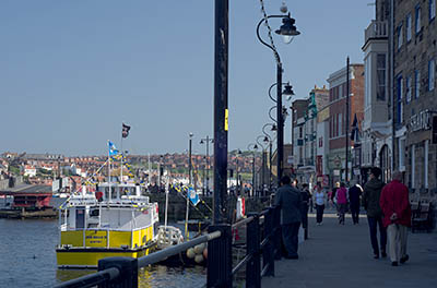 ENG: Yorkshire & Humberside Region, North Yorkshire, North Yorkshire Coast, Whitby, Town Center, Shops face harbor along pedestrianized Pier Road [Ask for #270.159.]