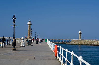 ENG: Yorkshire & Humberside Region, North Yorkshire, North Yorkshire Coast, Whitby, West Pier, Stone pillar beacons, resembling lighthouses, mark the ends of the stone piers at the harbor's mouth [Ask for #270.164.]