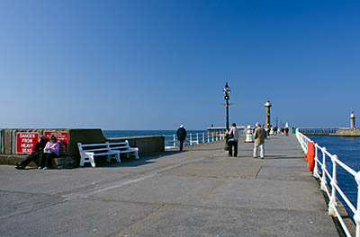 ENG: Yorkshire & Humberside Region, North Yorkshire, North Yorkshire Coast, Whitby, West Pier, Stone pillar beacons, resembling lighthouses, mark the ends of the stone piers at the harbor's mouth [Ask for #270.165.]