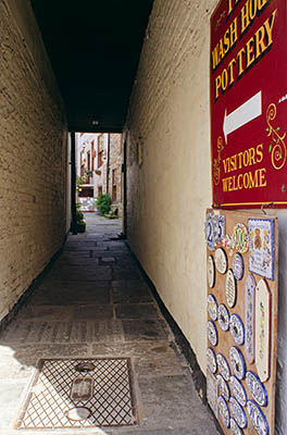 ENG: Yorkshire & Humberside Region, North Yorkshire, North Yorkshire Coast, Whitby, Town Center, View down Blackburns Yard, one of many tiny passageways leading off Church Street, a pedestrianized shopping district carrying the Cleveland Way [Ask for #270.200.]