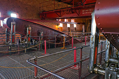 ENG: West Midlands Region, Staffordshire, The Trent Valley, Burton-on-Trent, Claymills Pumping Station, The massive beams of two restored and operating steam pumping engines share the same housing [Ask for #270.220.]