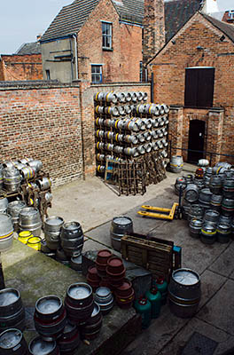 ENG: West Midlands Region, Staffordshire, The Trent Valley, Burton-on-Trent, Burton Bridge Brewery, Town Center, Casks stacked behind the brewery, waiting to be shipped [Ask for #270.242.]