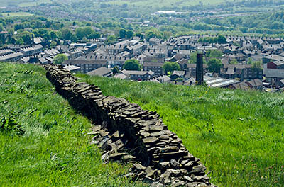 ENG: The Northwest Region, Lancashire, The Pennines, Rossendale, Haslingden, Halo Panopticon, Top o' Slate Nature Reserve. View from the approach lane over the town of Haslingden [Ask for #270.275.]