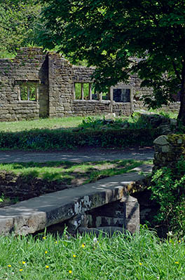 ENG: The Northwest Region, Lancashire, The Pennines, Pendle, Wycoller Country Park, Clapper bridge by ruinous18th c. Wycoller Hall, the model for Ferndean Manor in "Jane Eyre". The Bronte Way and Pennine Bridleway pass. [Ask for #270.305.]