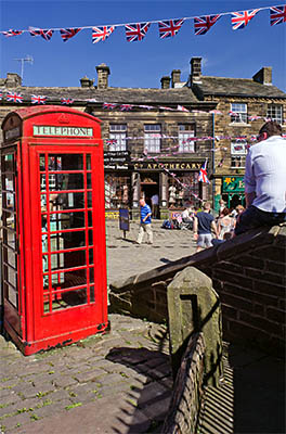 ENG: Yorkshire & Humberside Region, West Yorkshire, Bradford Borough, Haworth, Main Street, at the center of the village; red phone box [Ask for #270.329.]