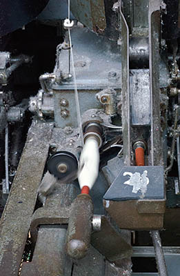 ENG: The Northwest Region, Lancashire, The Pennines, Burnley Borough, Briercliffe, Queen Street Mill, Belt-powered machine placing thread on a spindle for use in a loom in this fully functioning steam powered Victorian textile plant [Ask for #270.392.]