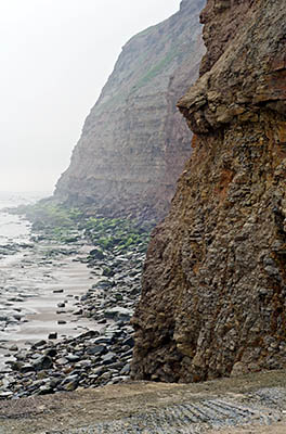 ENG: Yorkshire & Humberside Region, North Yorkshire, North Yorkshire Coast, Skinningrove, Cliffs that surround the village, from the harbor, in fog [Ask for #270.450.]