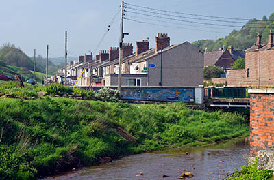 ENG: Yorkshire & Humberside Region, North Yorkshire, North Yorkshire Coast, Skinningrove, Main street of iron mining town located in a deep gorge cutting through the sea cliffs [Ask for #270.454.]