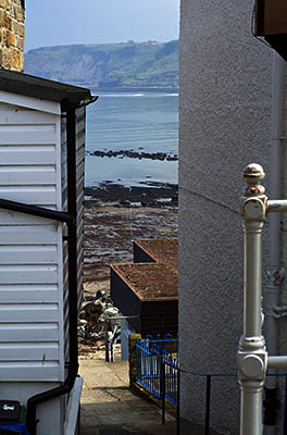 ENG: Yorkshire & Humberside Region, North Yorkshire, North Yorkshire Coast, Sea Cliffs, Runswick Bay, Old fishing village terraces up from the cliff foot; paths, not roads, serve these cottages [Ask for #270.467.]