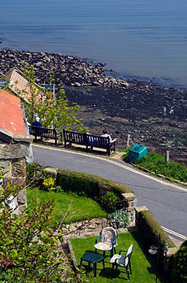 ENG: Yorkshire & Humberside Region, North Yorkshire, North Yorkshire Coast, Sea Cliffs, Runswick Bay, Old fishing village terraces up from the cliff foot; view to the bay and cliffs [Ask for #270.471.]