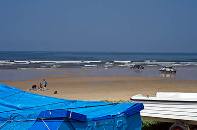 ENG: Yorkshire & Humberside Region, North Yorkshire, North Yorkshire Coast, Saltburn-by-the-Sea, Saltburn Sands. Fishing boats line up along the beach, underneath the cliffs. [Ask for #270.482.]