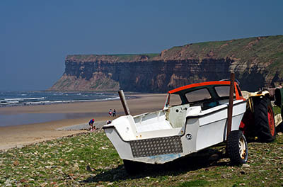 ENG: Yorkshire & Humberside Region, North Yorkshire, North Yorkshire Coast, Saltburn-by-the-Sea, Saltburn Sands. Fishing boat along the beach, underneath the cliffs. [Ask for #270.483.]