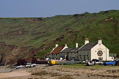 ENG: Yorkshire & Humberside Region, North Yorkshire, North Yorkshire Coast, Saltburn-by-the-Sea, Saltburn Sands. A pub and cottages sandwiched between the sands and the cliffs. [Ask for #270.485.]