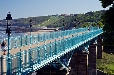 ENG: Yorkshire & Humberside Region, North Yorkshire, North Yorkshire Coast, Scarborough City, Town Centre, A Victorian pedestrian viaduct links one cliff with another over a small valley at town center; beach and cliffs in bkgd [Ask for #270.525.]