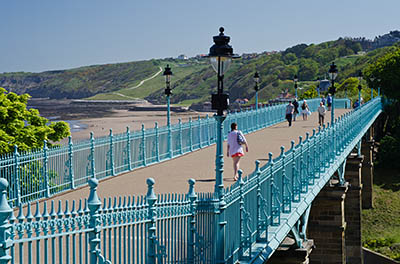 ENG: Yorkshire & Humberside Region, North Yorkshire, North Yorkshire Coast, Scarborough City, Town Centre, A Victorian pedestrian viaduct links one cliff with another over a small valley at town center; beach and cliffs in bkgd [Ask for #270.526.]