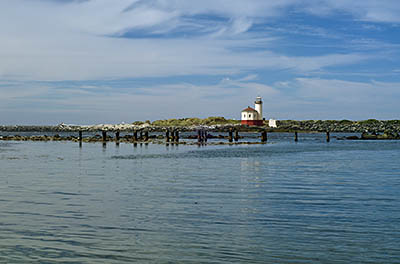 OR: South Coast Region, Coos County, Bandon Area, Town of Bandon, Coquille River Mouth, South Jetty, View across river to Coquille River Lighthouse in Bullards Beach State Park [Ask for #271.146.]