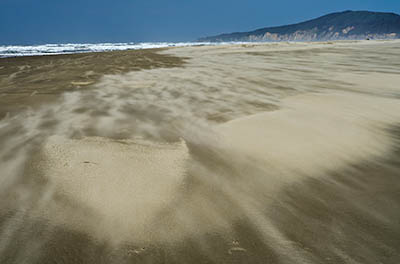 OR: South Coast Region, Coos County, Bandon Area, North Beaches, Seven Devils State Wayside, Strong winds whip the sasnd along the beach [Ask for #274.079.]