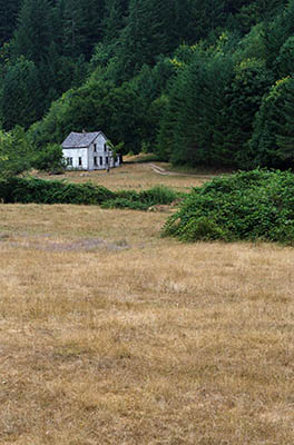 OR: South Coast Region, Douglas County, Pacific Coast, Reedsport Area, Umpqua River Scenic Corridor (SR 38), An abandoned farmhouse surrounded by pastures at the foot of this mainline logging road. [Ask for #274.629.]