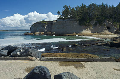 OR: Coos County, Coos Bay Area, Cape Arago Parks, Bastendorff Beach County Park, The cliffs of Coos Head, the mouth of Coos Bay, and the landward terminus of South Jetty, all converge at the northern end of the beach. [Ask for #274.835.]