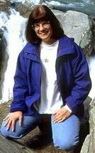 Portrait of Kasey Hargan by a waterfall in the Great Smoky Mountains National Park, by Jim Hargan